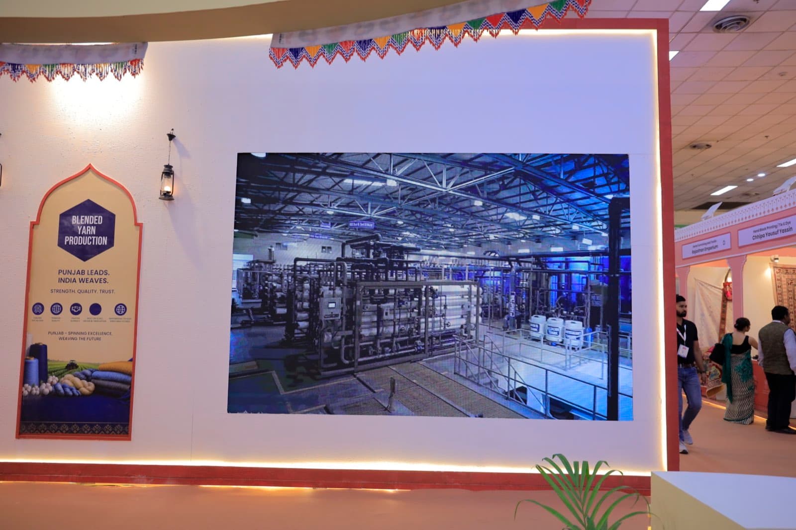 Blended yarn production exhibit with industrial media display at BharatTex